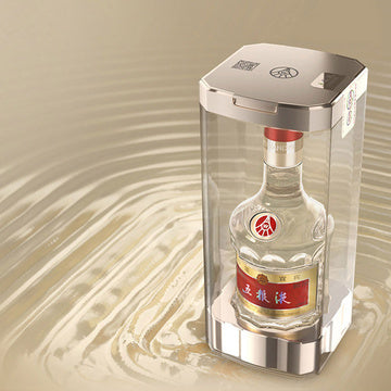 Bottle of Baijiu in a transparent box on a beige background