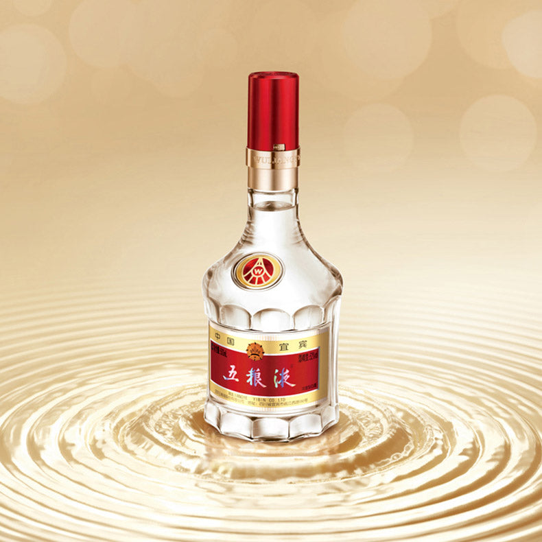 Bottle of Baijiu with a red cap on a beige background