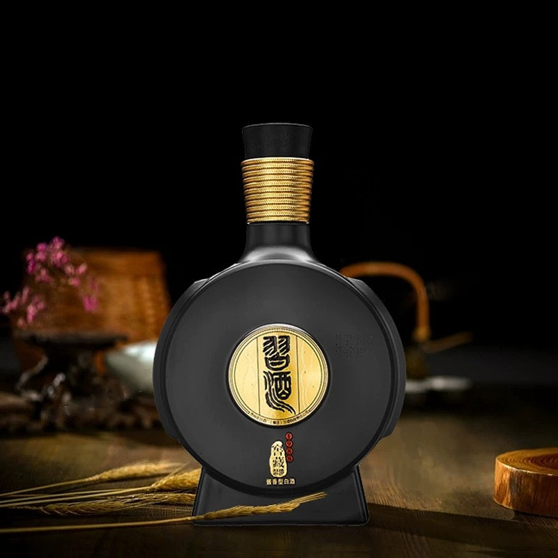 Load image into Gallery viewer, Xijiu Jiao Cang 1988 Baijiu black bottle with gold accents on a dark background