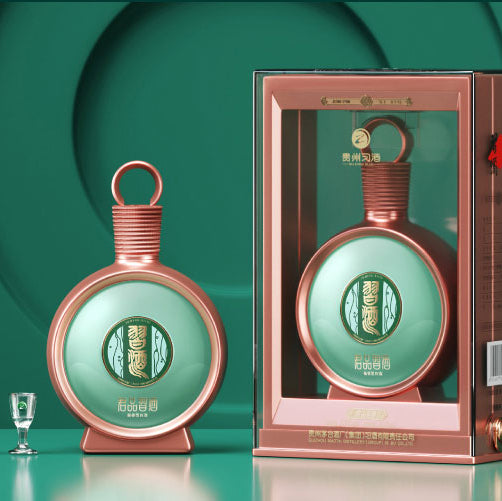 Load image into Gallery viewer, A bottle of Xijiu JunPin Baijiu 53% 500ml  with gift packaging and glasses on a green background