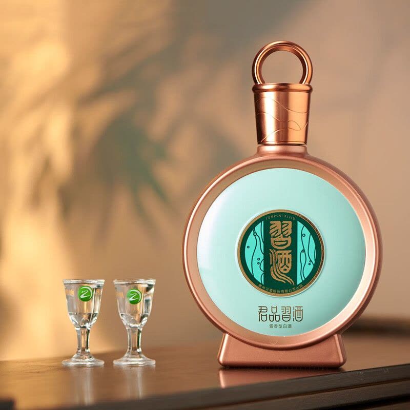 Load image into Gallery viewer, A bottle of Xijiu JunPin Baijiu 53% 500ml next to two sipping glasses