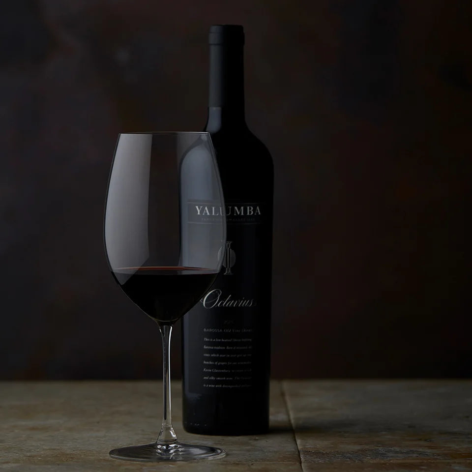 Yalumba Rare and Fine The Octavius shiraz  bottle and glass of red wine on a dark background