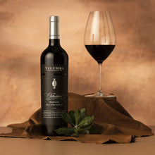 Load image into Gallery viewer, Yalumba Rare and Fine The Octavius bottle and glass of red wine on a textured surface with a warm brown background