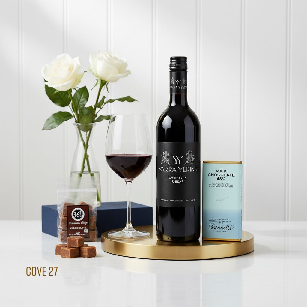 Load image into Gallery viewer, Wine bottle, glass, and chocolate on a white surface with a decorative background