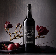Load image into Gallery viewer, Yarra-Yering-Carrodus-Shiraz wine bottle with floral and fruit decorations on a dark background