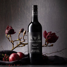 Load image into Gallery viewer, Yarra Yering wine bottle with decorative elements on a dark background