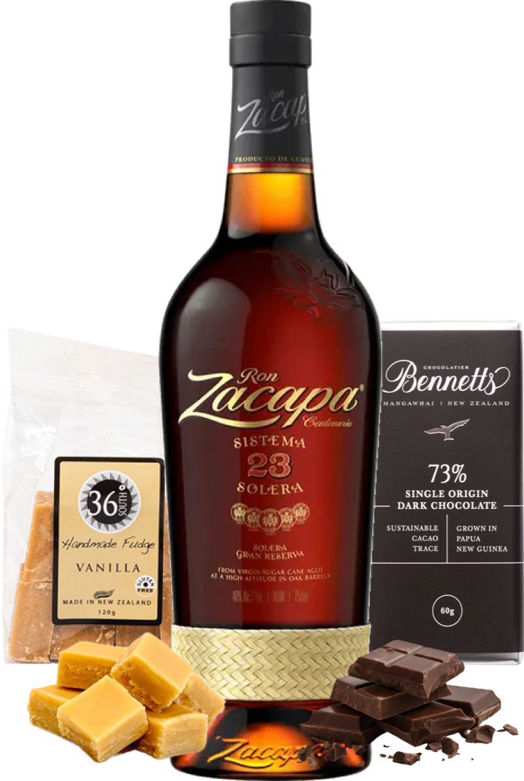 Load image into Gallery viewer, Bottle of Ron Zacapa 23 year old rum with chocolate, fudge, and a bar of chocolate on a white background