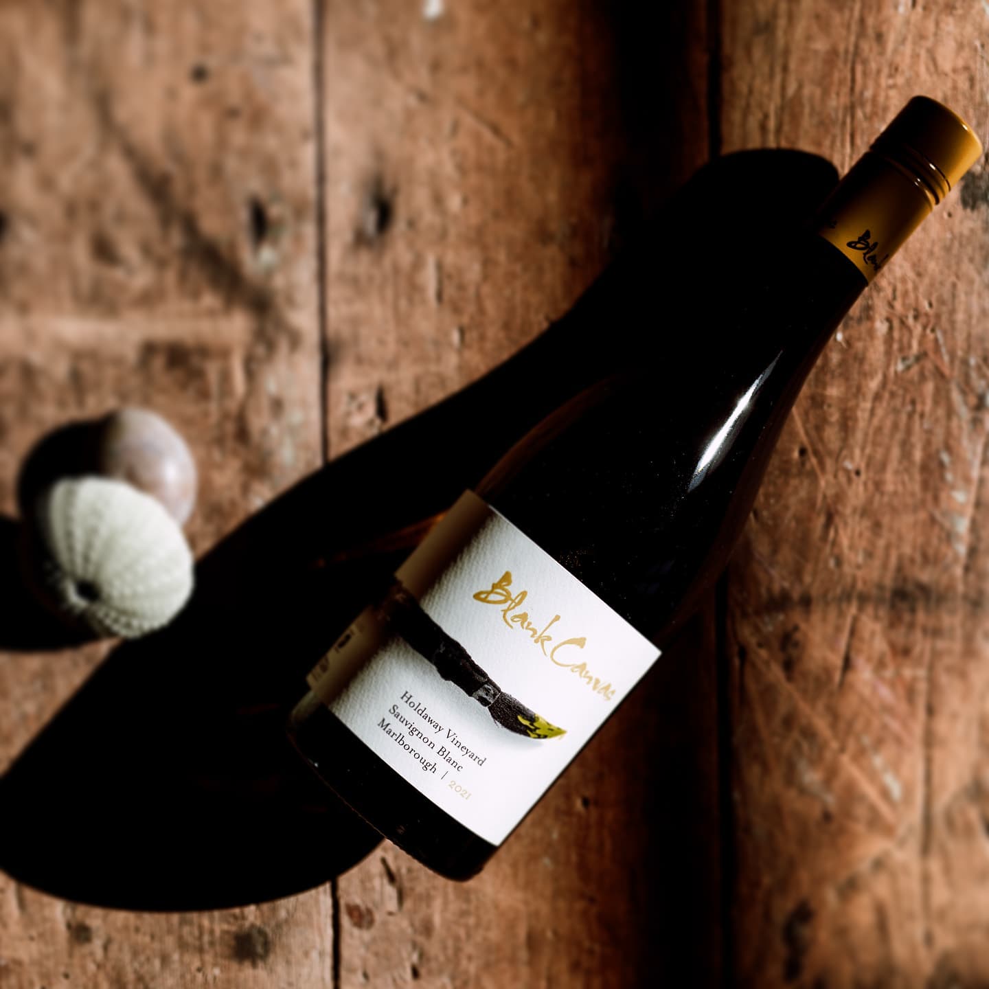 Load image into Gallery viewer, Wine bottle with a label on a wooden surface