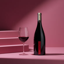 Load image into Gallery viewer, church_road_1_syrah wine bottle and glass on a pink geometric background