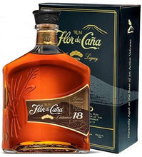 Load image into Gallery viewer, An image of a bottle of Flor de Cana 18 year old dark rum beside its gift box from Nicaragua