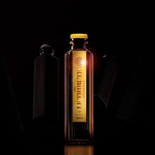 Load image into Gallery viewer, Bottle of Le Tribute ginger beer with a dark background
