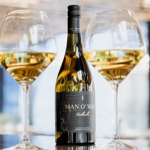Load image into Gallery viewer, Bottle of Man O' War Valhalla Chardonnay white wine with two glasses filled with wine on a reflective surface.