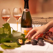 Load image into Gallery viewer, Veuve Clicquot champagne bottle with two glasses and figs on a table