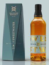 Load image into Gallery viewer, An image of a bottle of Waiheke Whisky Sweatwater Single Malt Whisky 700ml next to its stunning blue gift box