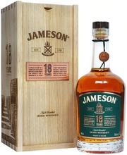 Load image into Gallery viewer, An image of a bottle of Jameson 18 year old Limited Reserve whiskey next to its stunning wooden gift box