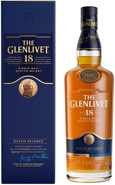 An image of a premium bottle of Glenlivet 18 Year Old Single Malt Scotch Whisky next to its fine blue gift box